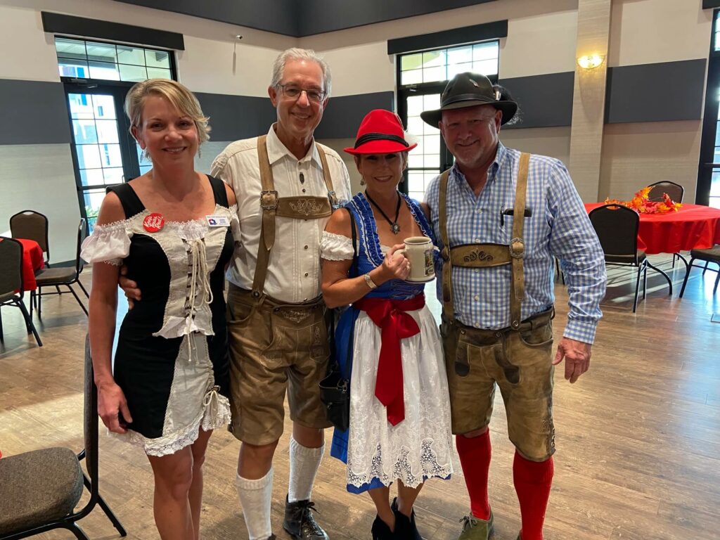 A group of people dressed in german clothing.